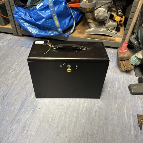 Wall-mounted Yale lock box for secure key storage.