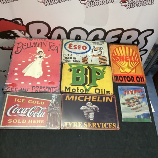 Lot of vintage reproduction advertising signs including Esso and Shell.