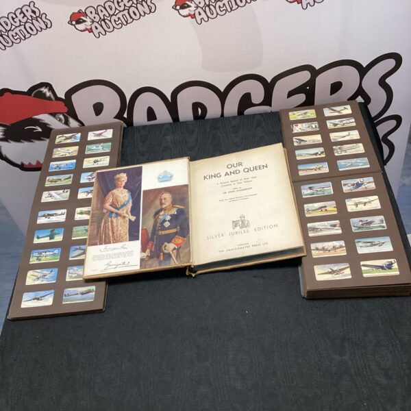 Vintage Silver Jubilee cigarette picture albums, front covers shown.