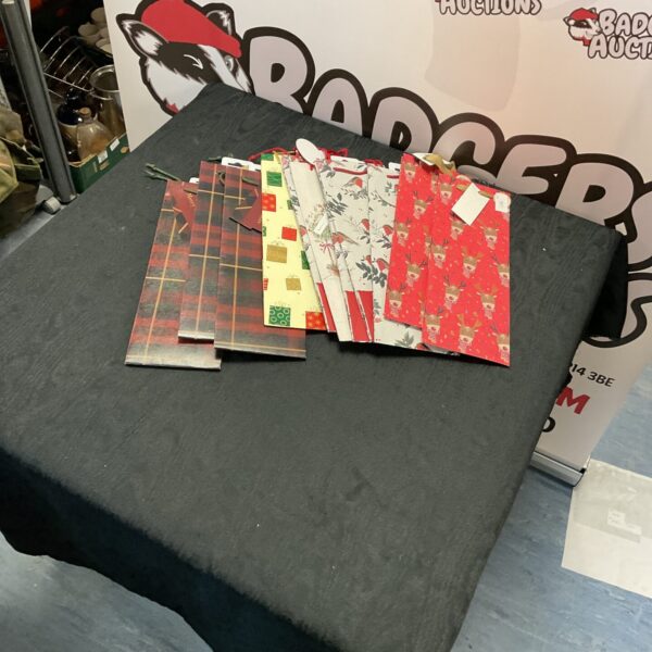 Selection of patterned Christmas gift bags for festive gift-giving.