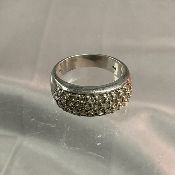 Silver ring with cubic zirconia stones, size R.