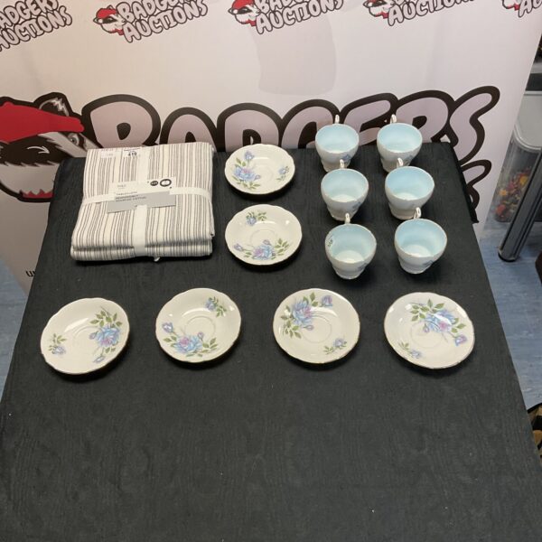 Floral M&S tablecloth and vintage Paragon teacups and saucers set.