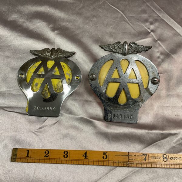 Pair of vintage AA car badges for classic car restoration.