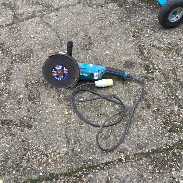 Makita 110v angle grinder power tool for metalworking and DIY projects.