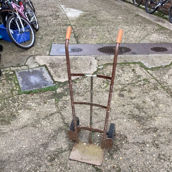 Vintage sack barrow with a single wheel, ideal for garden or industrial use.