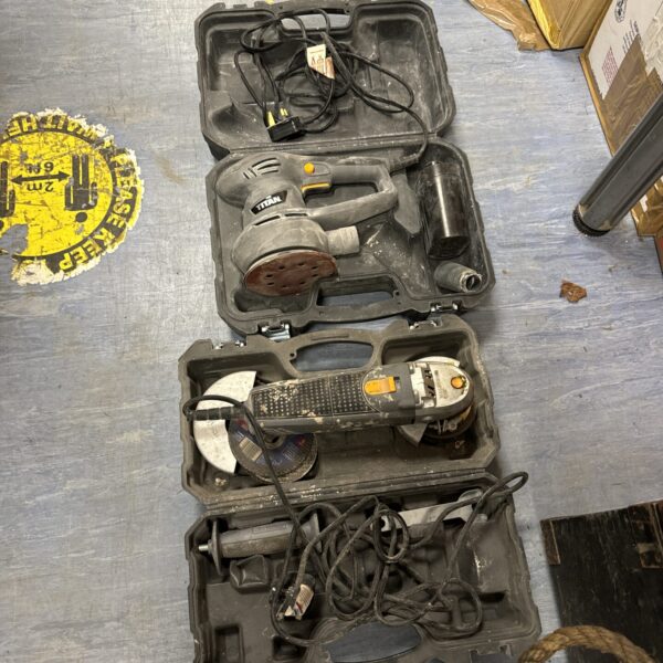 Titan pad sander and angle grinder set in a carrying case.