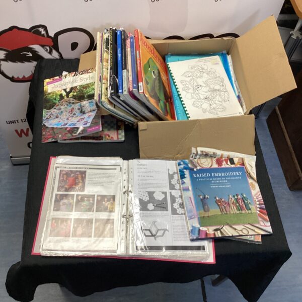 Lot of vintage embroidery and quilting books for crafting inspiration.