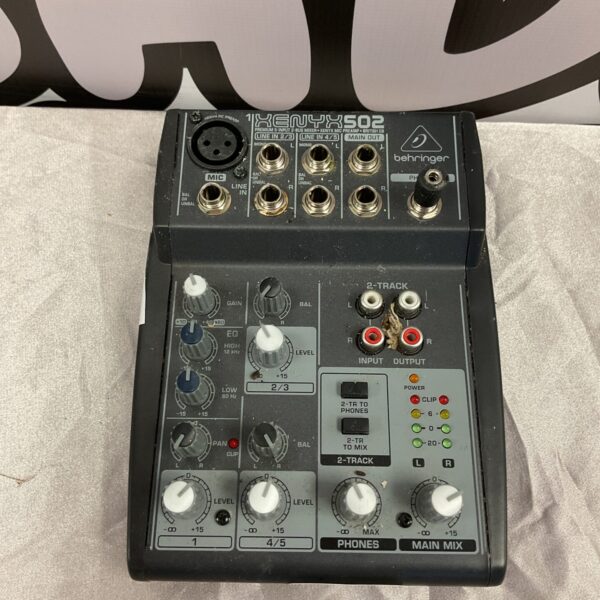 Front view of a Behringer Xenyx 502 audio mixer console.