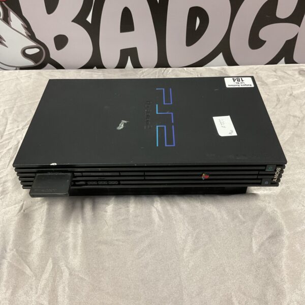 Slimline Sony PlayStation 2 console with memory card for retro gaming.