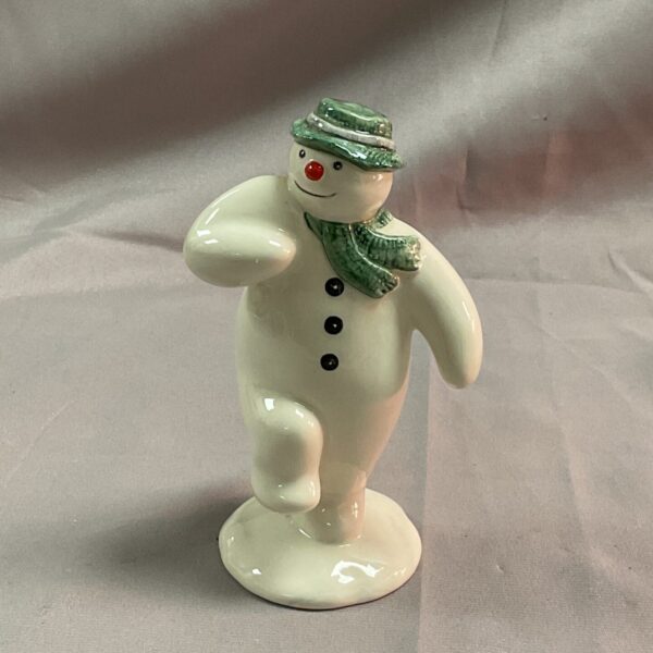 Royal Doulton Snowman figurine in a charming pose.