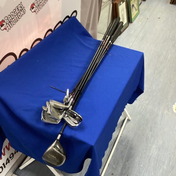 Vintage Ben Sayers golf club set displayed on a table.