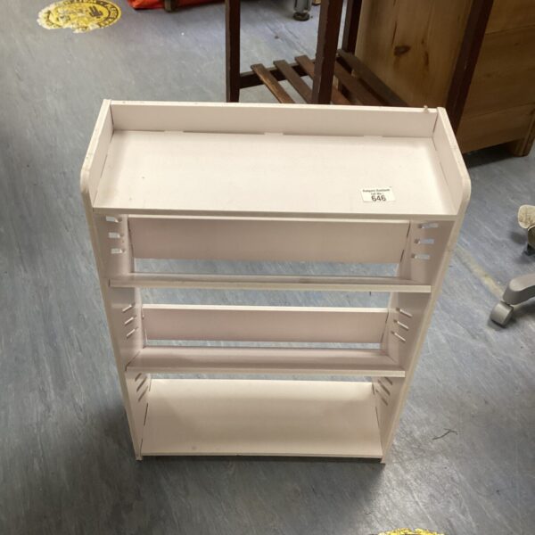 Small wooden shoe rack with three tiers for shoe storage.