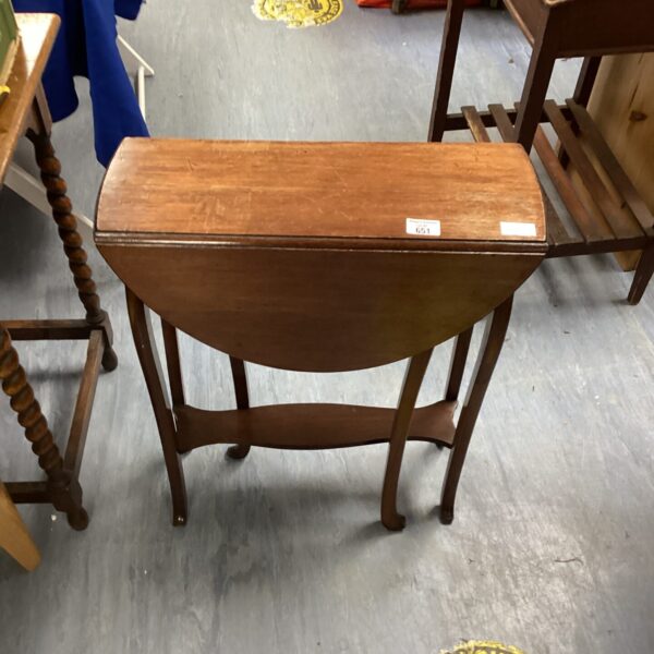 Antique mahogany gate leg table with hinged leaves.
