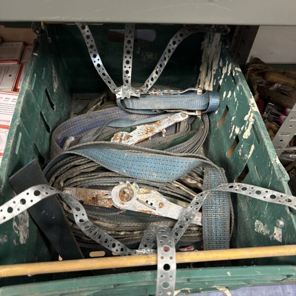 A box of used ratchet straps for securing cargo.
