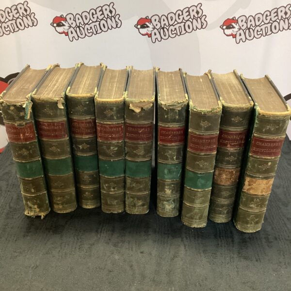 Nine volumes of antique Chamber’s Encyclopaedia in leather bindings.