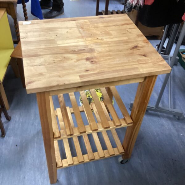 Rustic pine butchers block for kitchen food preparation.