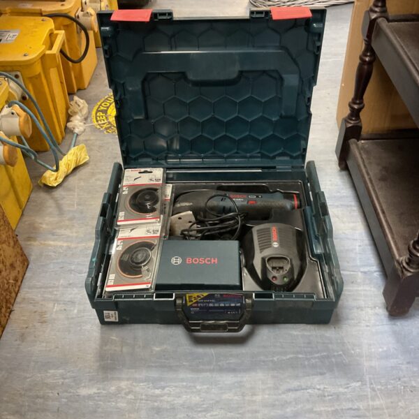 Bosch cordless multi tool in open carrying case.