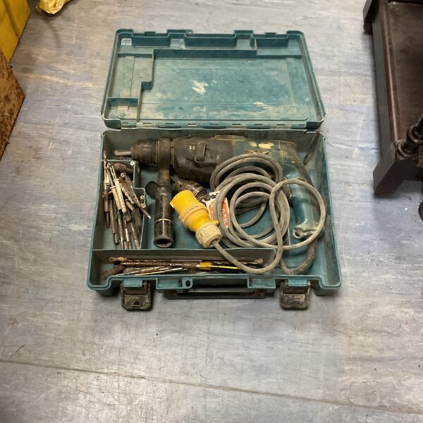 Vintage Makita hammer drill in original case with drill bits.