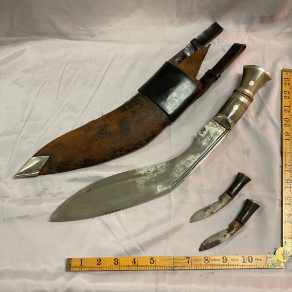 Vintage kukri knife with leather sheath and skinning knife.