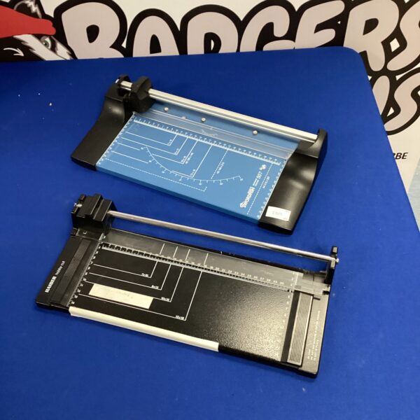 Vintage paper guillotine for crafting and office use, showing graduated scale.
