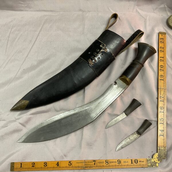Vintage kukri knife set with scabbard and skinning knife.