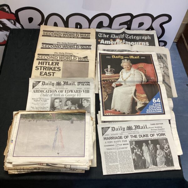 Collection of vintage newspapers covering historical events like WWII and Edward VIII.