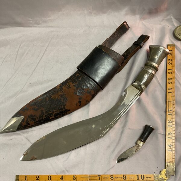 Vintage kukri knife with leather sheath and skinning knife.