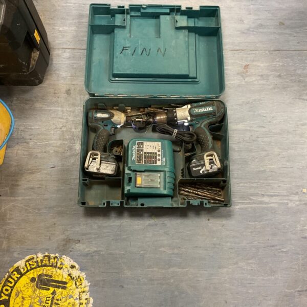Makita combi drill and impact driver set in carry case.