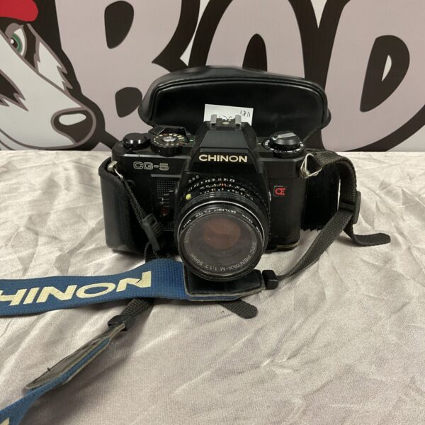 Front view of a vintage Chinon CG-5 35mm film camera.
