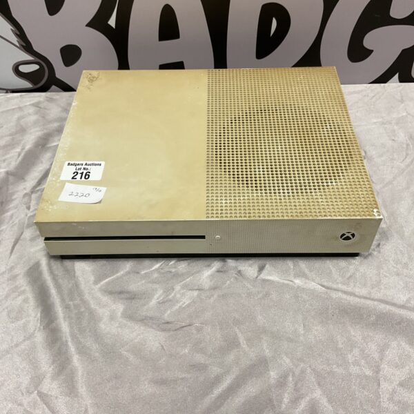 Black Microsoft Xbox One gaming console, side view.