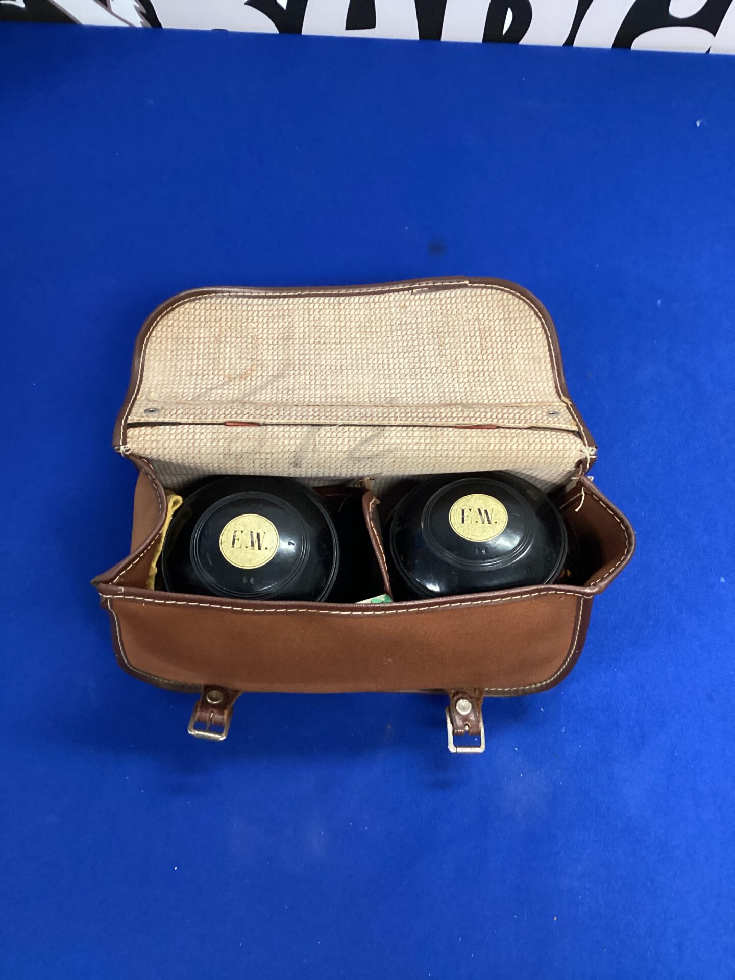 622 Two E.W garden bowles in leather bag