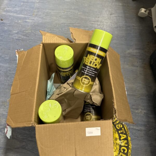 Five cans of vibrant neon yellow spray paint in a cardboard box.