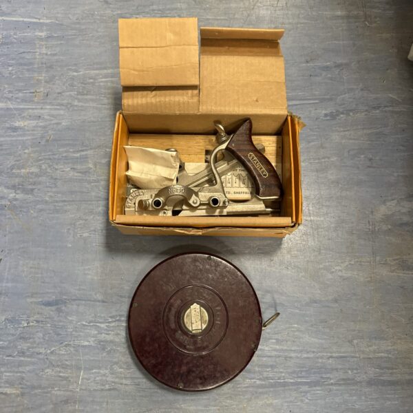 Vintage Stanley No 50 wood plane with Eslon tape measure for woodworking.