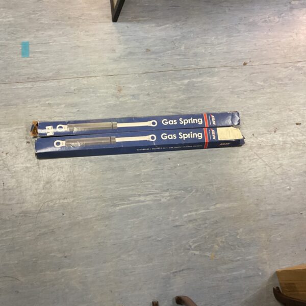 Kilen gas springs in original packaging for vehicle bonnet support.