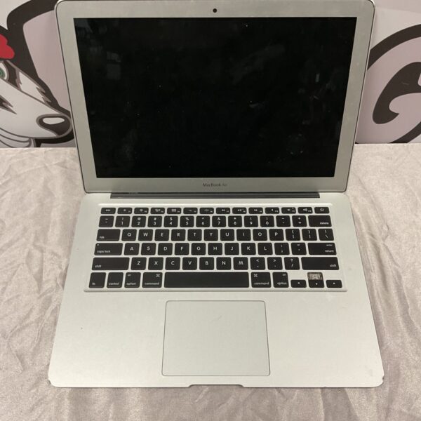 Silver Apple MacBook Air laptop, vintage computer for collectors.