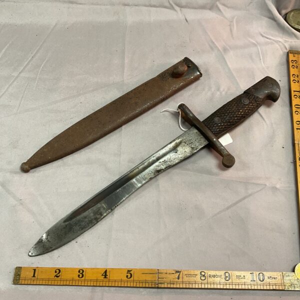 Spanish 1941 bolo bayonet and scabbard set, antique military collectible.