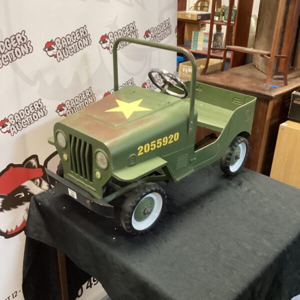 Vintage metal ride-on Jeep, classic toy car for collectors.