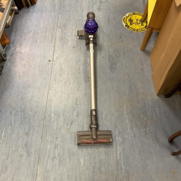 Dyson V6 cordless vacuum cleaner in silver and blue.