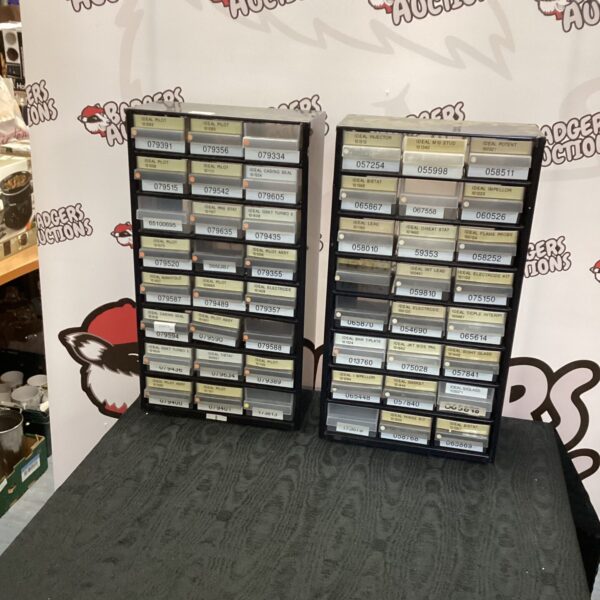 Two plastic garage storage units for tool organisation.