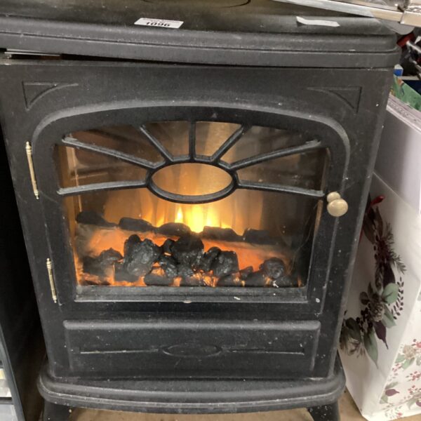 Electric stove heater with visible flame effect for home warming.