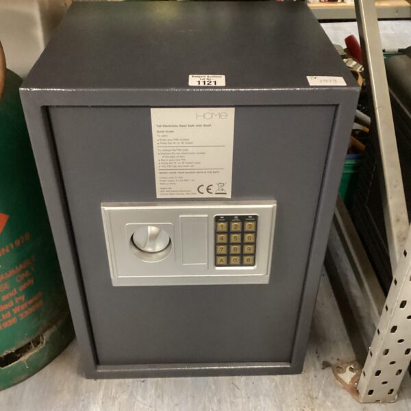 Front view of a steel home combination safe with a combination lock.