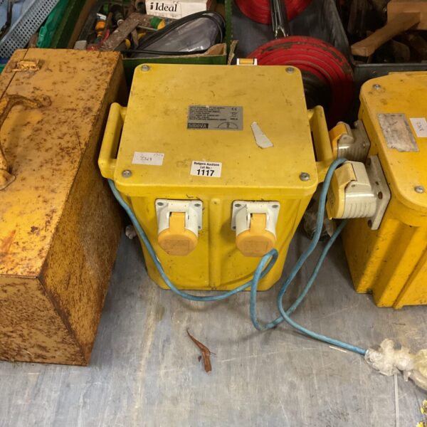 Yellow 110v transformer with multiple output sockets.