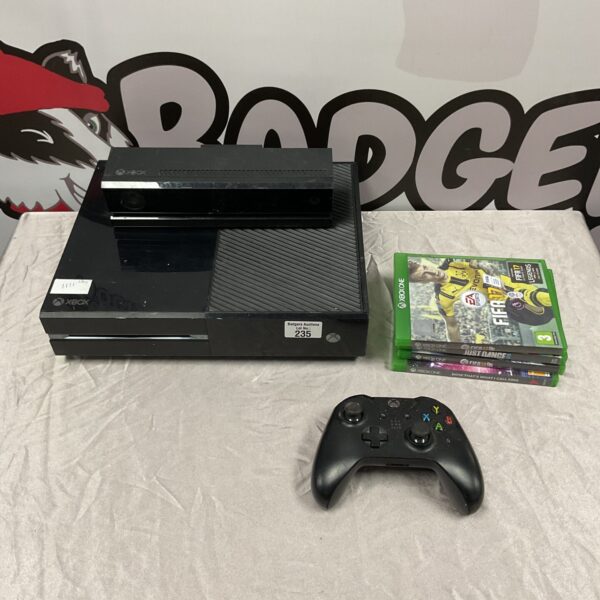 Xbox One console bundle with controller and games displayed.