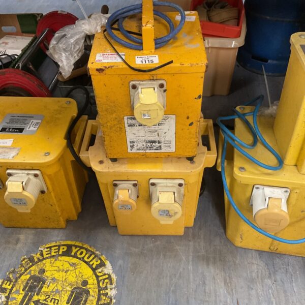 Yellow 110v transformer with multiple socket outputs.