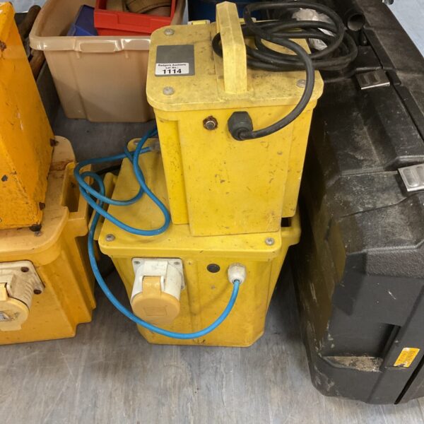 Yellow industrial 110v transformer with multiple sockets.
