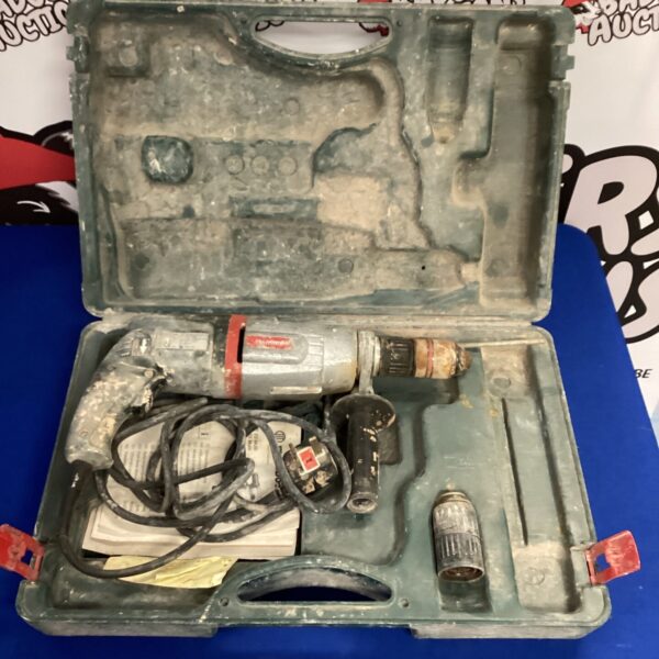 Vintage Metabo hammer drill in open carry case.