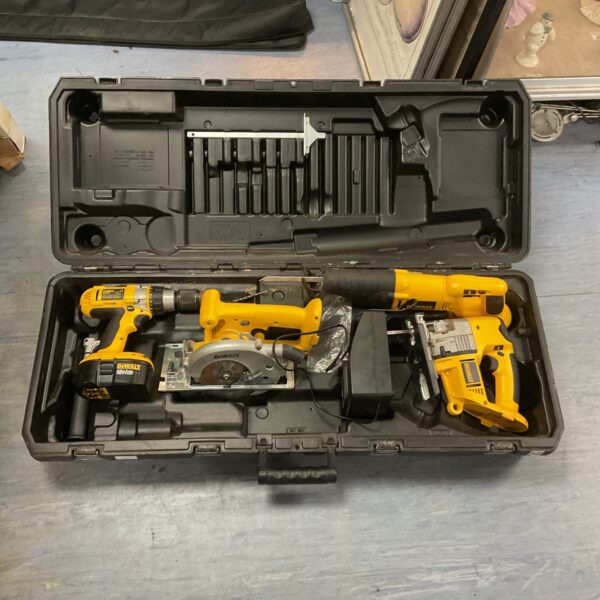 Open Dewalt cordless tool set with various power tools inside.