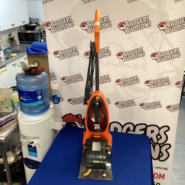 Yellow and black Vax carpet cleaner, model V-035.