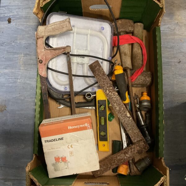Assorted tools including a site light and hammer in a wooden tray.