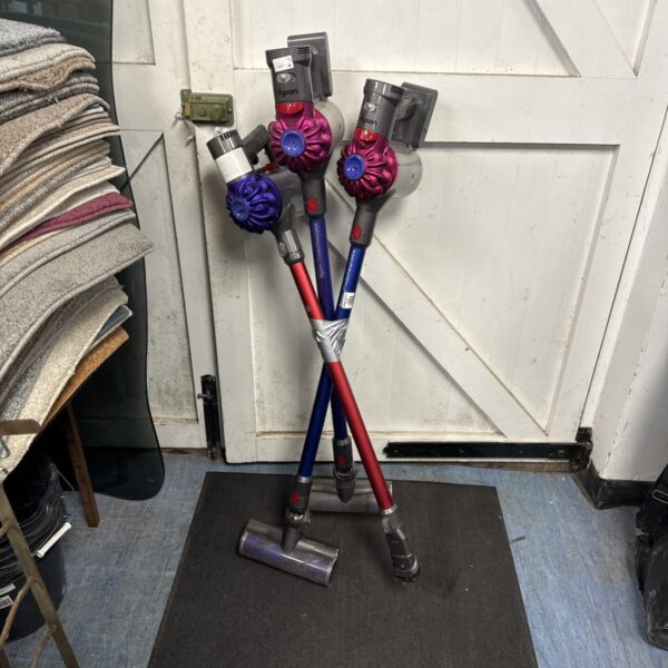 Lot of three Dyson cordless hoovers for spares and repair.